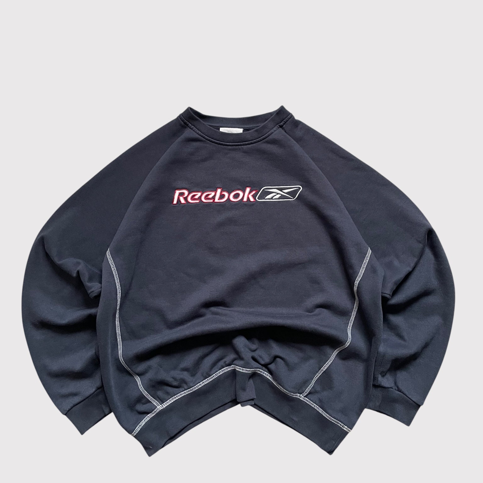 Vintage Reebok sweatshirt in navy with an embroidered central logo